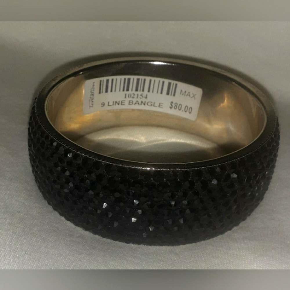 Temptations 9 inch black jeweled bangle bracelet.